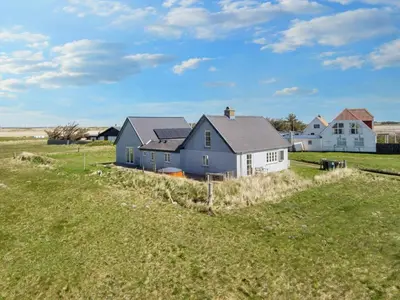 a house in the middle of a field at 10 person holiday home in Harboøre-By Traum in Harboør