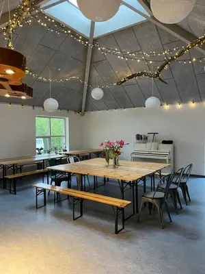 a dining room with a table and chairs and lights at Room 12 - Hawkraft Kulturhotel in Vestervig