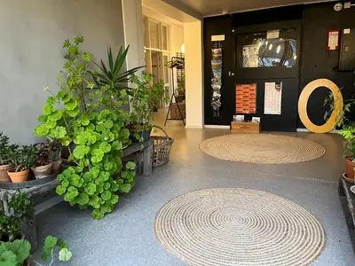 a lobby with a bunch of potted plants at Room 19 - Hawkraft kulturhotel in Vestervig