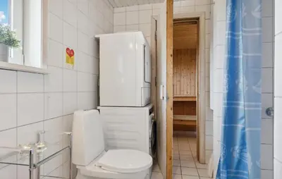 a bathroom with a white toilet at Stunning Home In Løkken With Sauna in Løkken