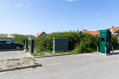 a parking lot with a car parked next to a street at Agger Holidays in Vestervig