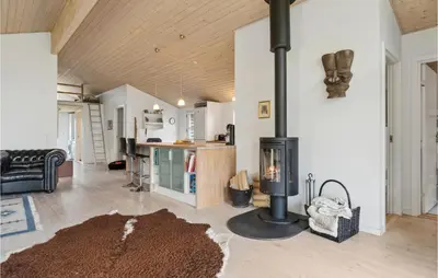 a living room with a wood stove in the middle at Pet Friendly Home In Saltum With Wifi in Saltum
