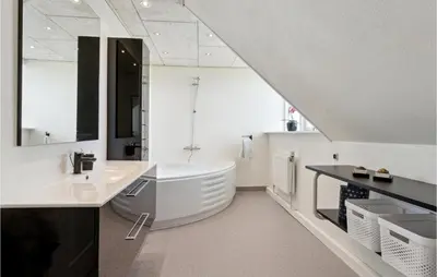 a white bathroom with a sink and a tub at Beautiful Home In Farsø With Kitchen in Farsø