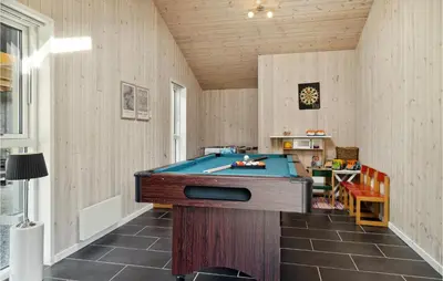 a room with a pool table in the middle of it at Gorgeous Home In Fjerritslev With Sauna in Fjerritslev