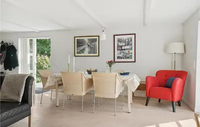 a dining room with a table and chairs at Amazing Home In Vesløs in Øsløs
