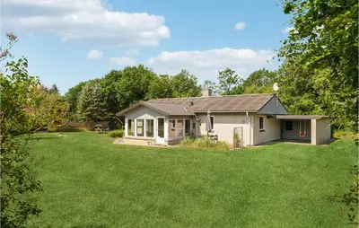 a small house with a large yard at Cozy Home In Spøttrup With Wifi in Spottrup