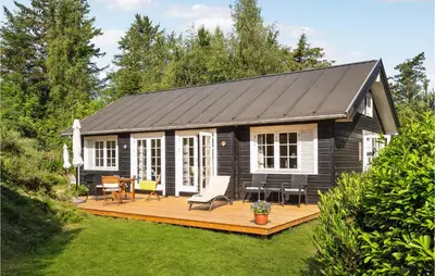 a small cabin with a deck in a yard at Stunning Home In Fur With Wifi in Fur