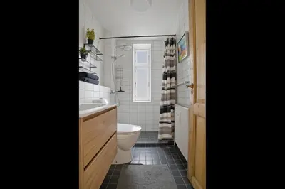 a bathroom with a toilet and a sink at Apartment in central Holstebro in Holstebro