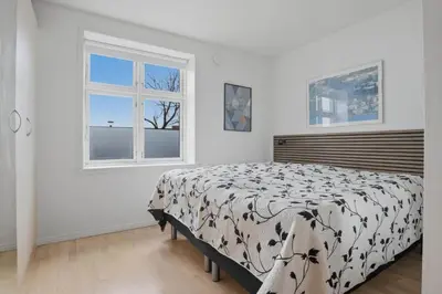 a bedroom with a bed and a window at Apartment in central Holstebro in Holstebro