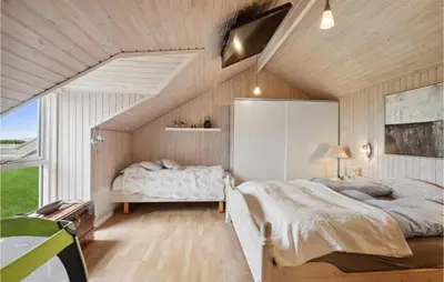 a bedroom with a large bed and a large window at 3 Bedroom Cozy Home In Løgstør in Løgsted