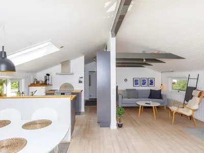 a kitchen and living room with a couch and a table at 6 person holiday home in Fjerritslev-By Traum in Fjerritslev