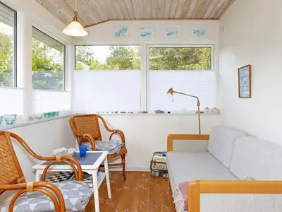 a living room with a couch and a table at 4 person holiday home in Hurup Thy-By Traum in Sønder Ydby
