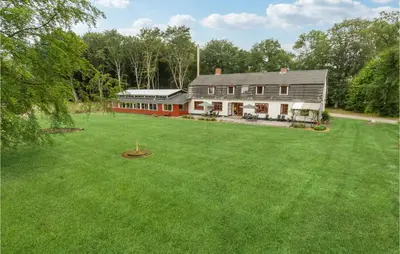 an aerial view of a house with a large yard at Cozy Home In Brovst With Kitchen in Brovst
