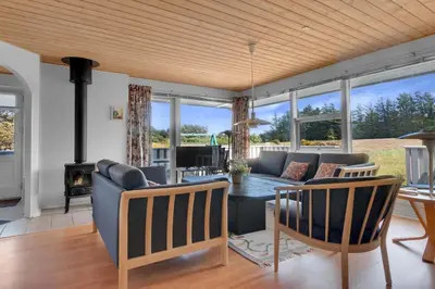 a living room with a couch and a table at Skytten 5 - Environmentally Friendly Holiday Home in Hune