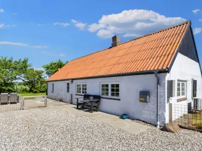 a small white house with an orange roof at 5 person holiday home in Karby-By Traum in Karby