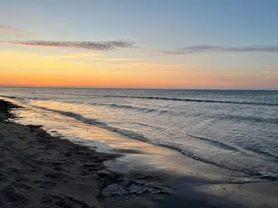 a view of the beach at sunset at 5 person holiday home in Karby-By Traum in Karby