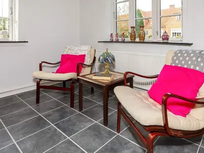 a living room with two chairs and a table at 6 person holiday home in Thisted-By Traum in Thisted