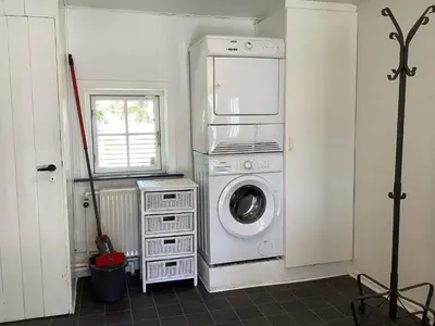 a laundry room with a washing machine and a window at 6 person holiday home in Thisted-By Traum in Thisted