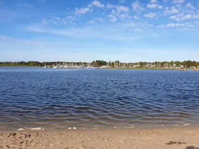 a large body of water with buildings in the background at 8 person holiday home in Højslev-By Traum in Højslev