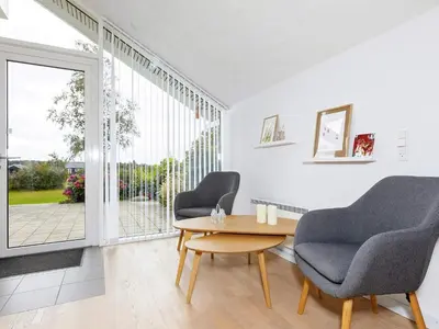 a living room with two chairs and a table at 8 person holiday home in Højslev-By Traum in Højslev