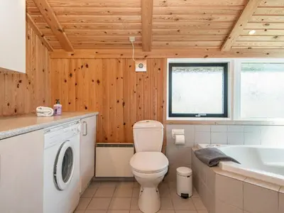 a bathroom with a toilet and a sink at 9 person holiday home in Harboøre-By Traum in Harboør