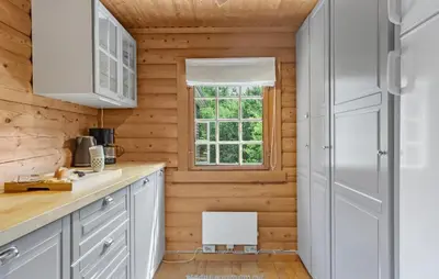 a kitchen with white cabinets and a window at Lovely Home In Højslev With Kitchen in Lundø