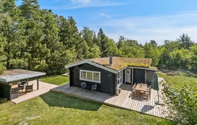 a tiny house with a deck and a gazebo at Lovely Home In Højslev With Kitchen in Lundø