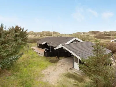 a house in the middle of a field at Holiday Home Lennja - 300m from the sea by Interhome in Saltum