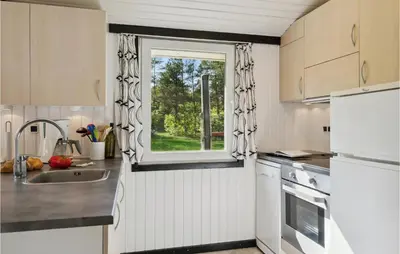 a kitchen with a sink and a window at Nice Home In Højslev With Kitchen in Højslev