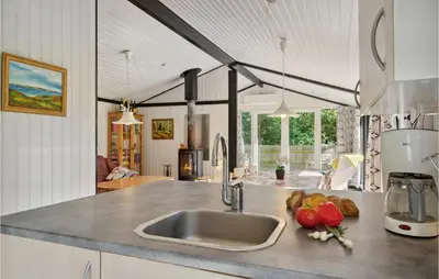 a kitchen with a sink and a counter top at Nice Home In Højslev With Kitchen in Højslev