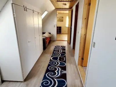 a hallway with a rug on the floor in a room at 8 person holiday home in Øster Assels-By Traum in Øster Assels