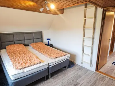 a bedroom with a bed in a room at 8 person holiday home in Øster Assels-By Traum in Øster Assels