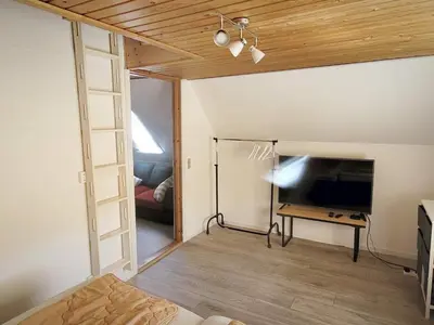 a room with a bed and a tv in a room at 8 person holiday home in Øster Assels-By Traum in Øster Assels