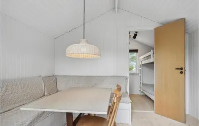 a dining room with a table and aendant light at Awesome Home In Saltum With Wifi in Saltum