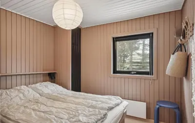 a bedroom with a bed and a window at Awesome Home In Saltum With Wifi in Saltum