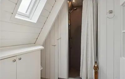 a bathroom with a shower and a white shower curtain at Gorgeous Home In Farsø With Kitchen in Farsø