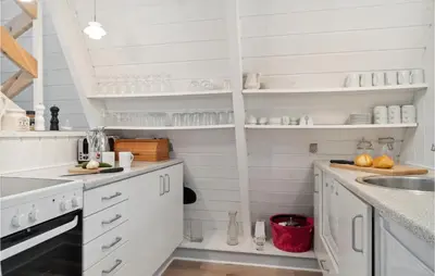 a white kitchen with white cabinets and a sink at Gorgeous Home In Farsø With Kitchen in Farsø