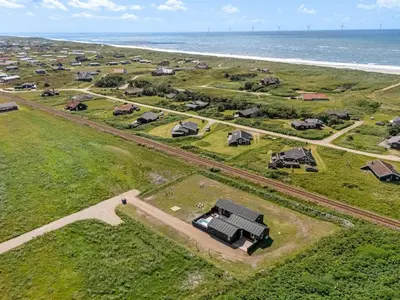 an aerial view of a farm near the ocean at Holiday Home Ivar - 300m from the sea by Interhome in Harboør