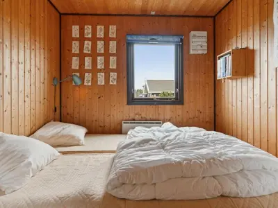 a bedroom with two beds and a window at Holiday Home Sulo - 1-4km from the sea by Interhome in Torsted