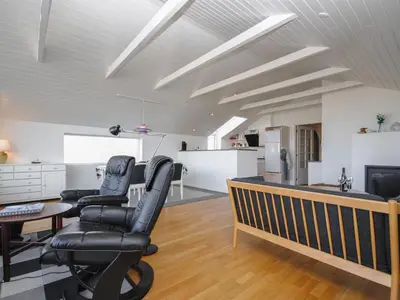 a living room with two chairs and a table at Holiday Home Hilmer - 250m from the sea by Interhome in Torsted
