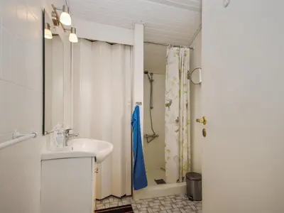 a bathroom with a sink and a shower at Holiday Home Hilmer - 250m from the sea by Interhome in Torsted