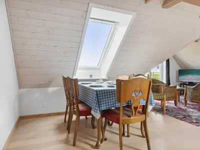 a dining room with a table and chairs at Apartment Dietlinde - 1-3km to the fjord by Interhome in Thyholm