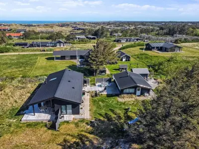 an aerial view of a home with a roof at Holiday Home Sampo - 400m from the sea by Interhome in Løkken