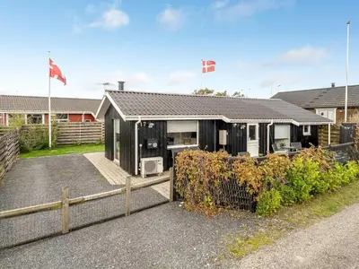 a house with a fence in front of it at Holiday Home Kielo - 200m to the fjord by Interhome in Løgstør