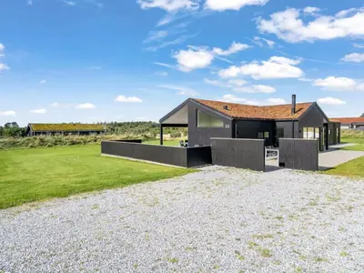 a house with a shingled roof at Holiday Home Egil - 1-5km from the sea by Interhome in Saltum