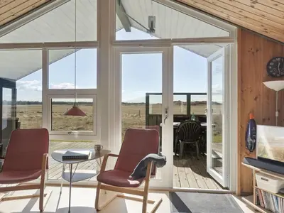 a glass house with a view of the desert at Holiday Home Tianna - 500m from the sea by Interhome in Pandrup