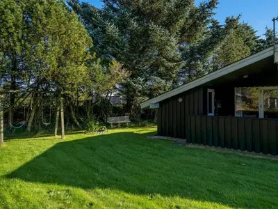 a yard in front of a house at Holiday Home Apsolon - 600m from the sea by Interhome in Løkken