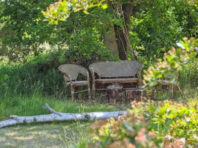 two chairs and a table under a tree at Holiday Home Nadia - 300m to the fjord by Interhome in Fur