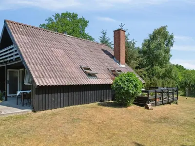 a house with a shingled roof on a yard at Holiday Home Nadia - 300m to the fjord by Interhome in Fur