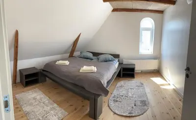 a bedroom with a bed with two towels on it at Apartment Vanilla - 2 rooms and one bathroom in Struer